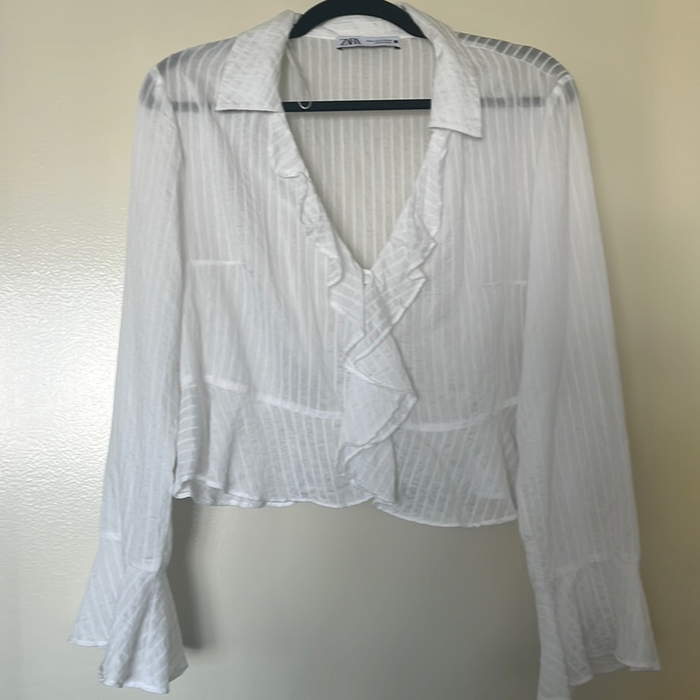 White ruffled top